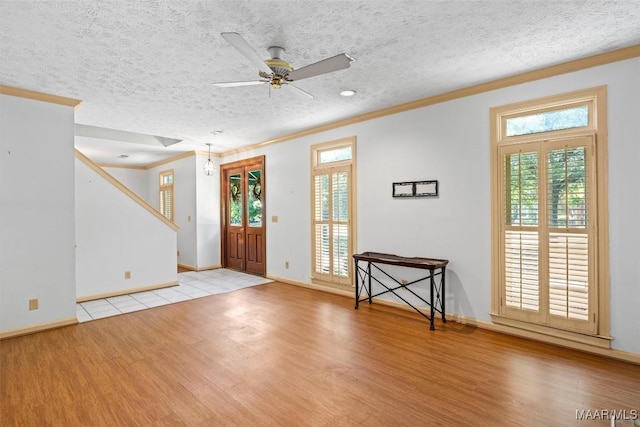 1641 Cairnbrook Dr, Montgomery, AL 36106 - foyer with light wood-type flooring, crown molding, ceiling fan, baseboards, and a textured ceiling