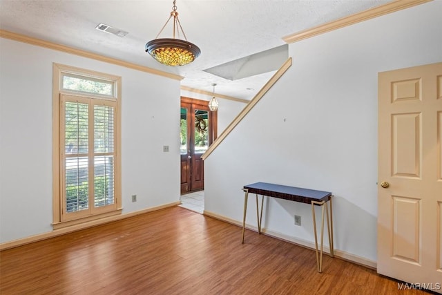1641 Cairnbrook Dr, Montgomery, AL 36106 - entryway featuring crown molding, wood finished floors, and baseboards
