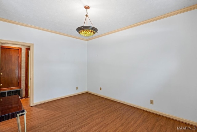 1641 Cairnbrook Dr, Montgomery, AL 36106 - spare room with wood finished floors, ornamental molding, and baseboards