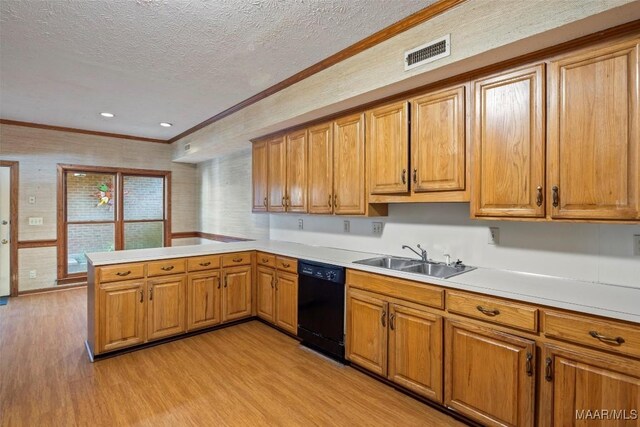 1641 Cairnbrook Dr, Montgomery, AL 36106 - kitchen featuring dishwasher, a sink, light wood-style floors, a textured ceiling, and ornamental molding