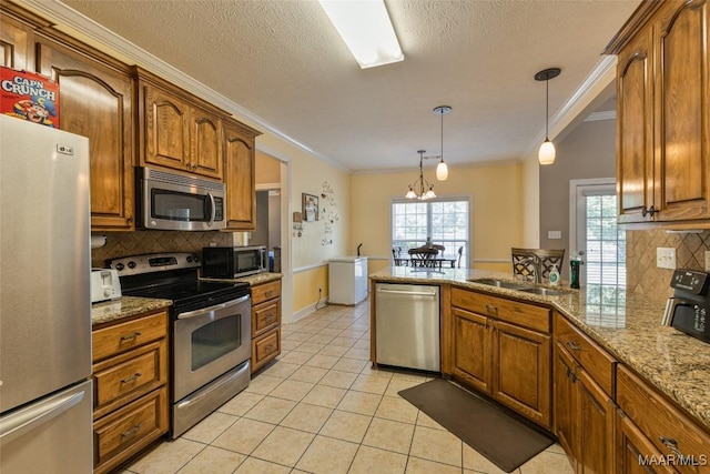 705 Coleman Way, Prattville, AL 36067 - kitchen with appliances with stainless steel finishes, crown molding, backsplash, light tile patterned floors, and brown cabinetry
