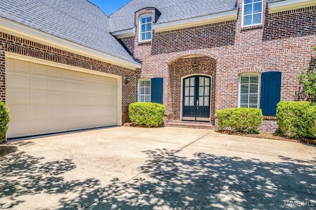 3412 Oak Grove Cir, Montgomery, AL 36116 - property entrance featuring brick siding, concrete driveway, an attached garage, and roof with shingles