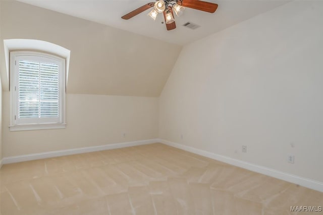 3412 Oak Grove Cir, Montgomery, AL 36116 - additional living space featuring a ceiling fan, light colored carpet, vaulted ceiling, and baseboards