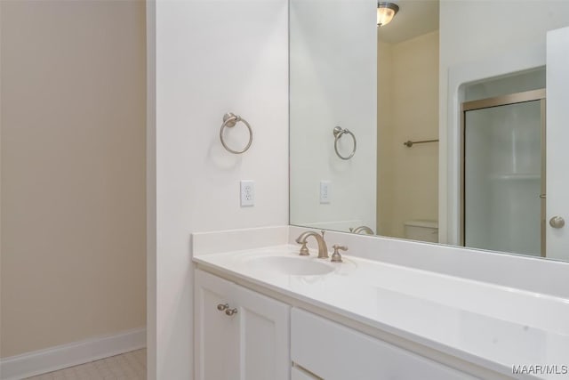 3412 Oak Grove Cir, Montgomery, AL 36116 - bathroom with vanity, baseboards, a shower stall, and toilet