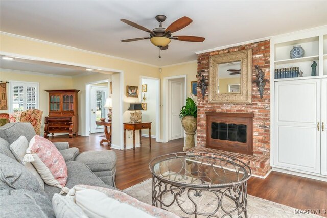 3469 Warrenton Rd, Montgomery, AL 36111 - living area with ceiling fan, wood finished floors, crown molding, a fireplace, and baseboards