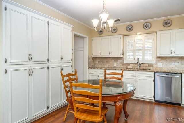 3469 Warrenton Rd, Montgomery, AL 36111 - kitchen with dishwasher, a sink, decorative backsplash, a chandelier, and white cabinetry