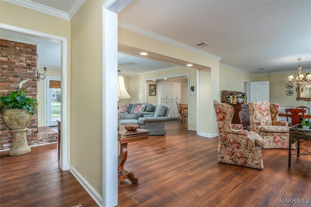 3469 Warrenton Rd, Montgomery, AL 36111 - living area featuring dark wood finished floors, baseboards, a chandelier, and crown molding