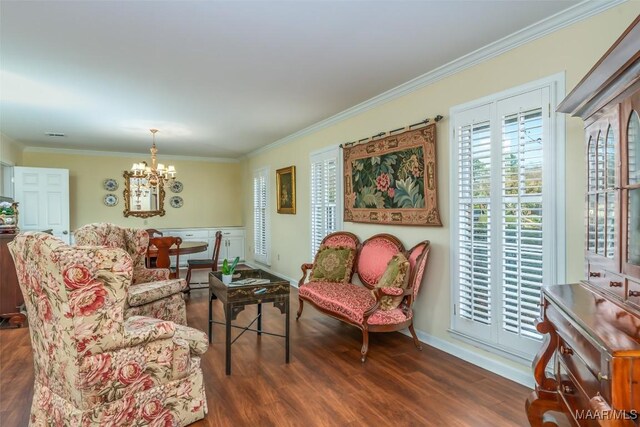 3469 Warrenton Rd, Montgomery, AL 36111 - living room featuring ornamental molding, a chandelier, wood finished floors, and baseboards