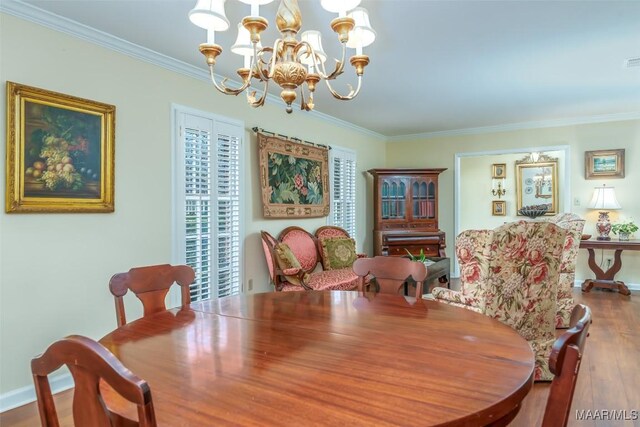3469 Warrenton Rd, Montgomery, AL 36111 - dining space featuring a chandelier, ornamental molding, wood finished floors, and baseboards