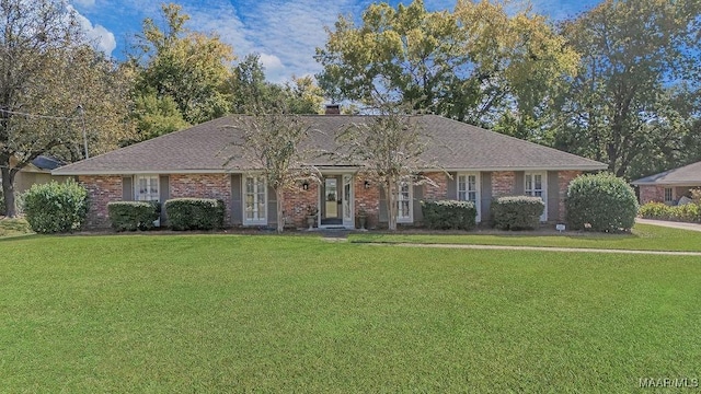 3469 Warrenton Rd, Montgomery, AL 36111 - view of front of home featuring a front lawn, brick siding, and a chimney