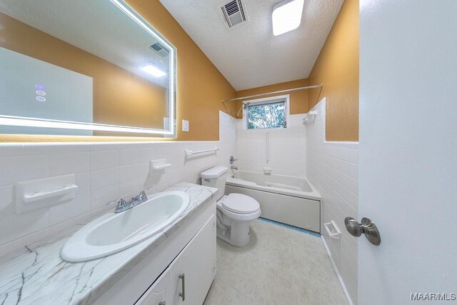 362 Bellehurst Dr, Montgomery, AL 36109 - full bath with tile walls, a wainscoted wall, vanity, a textured ceiling, and shower / tub combination