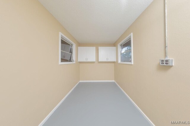 362 Bellehurst Dr, Montgomery, AL 36109 - hallway with baseboards and a textured ceiling