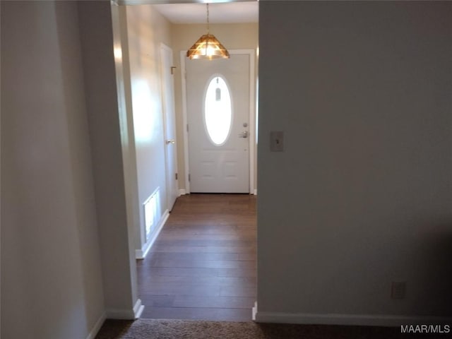 3950 Main St, Millbrook, AL 36054 - doorway to outside with baseboards and dark wood-style flooring
