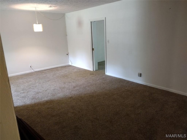 3950 Main St, Millbrook, AL 36054 - unfurnished room with carpet floors, baseboards, and a textured ceiling