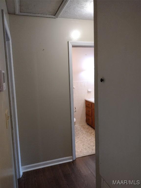 3950 Main St, Millbrook, AL 36054 - hall featuring dark wood-style flooring