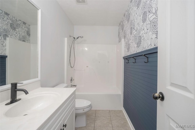 1600 Hawthorne Ln, Prattville, AL 36066 - bathroom featuring toilet, wallpapered walls, tile patterned floors, vanity, and tub / shower combination