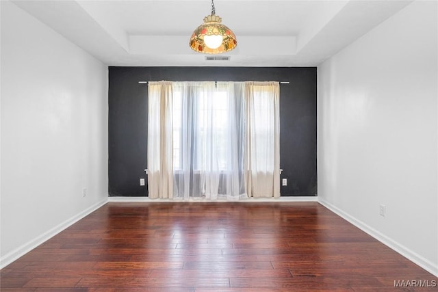 1600 Hawthorne Ln, Prattville, AL 36066 - empty room with a tray ceiling, wood-type flooring, and baseboards