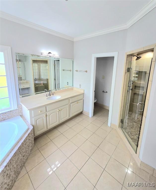 49 Berkeley Rd, Selma, AL 36701 - bathroom featuring ornamental molding, tile patterned floors, toilet, and a stall shower