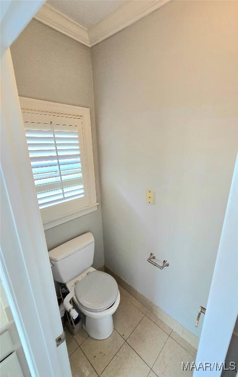 49 Berkeley Rd, Selma, AL 36701 - bathroom with ornamental molding, toilet, and tile patterned floors