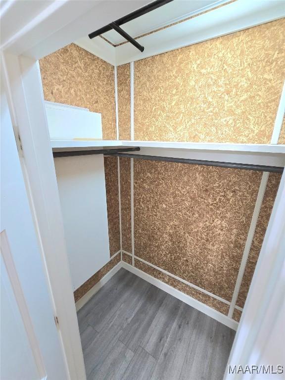 49 Berkeley Rd, Selma, AL 36701 - spacious closet featuring dark wood-style floors
