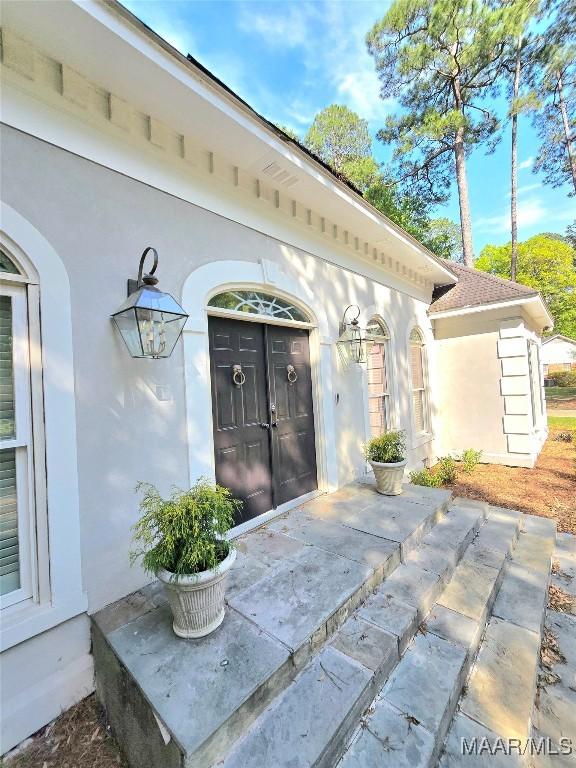 49 Berkeley Rd, Selma, AL 36701 - doorway to property with stucco siding