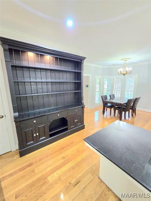 49 Berkeley Rd, Selma, AL 36701 - dining space with crown molding, light wood finished floors, a chandelier, recessed lighting, and baseboards