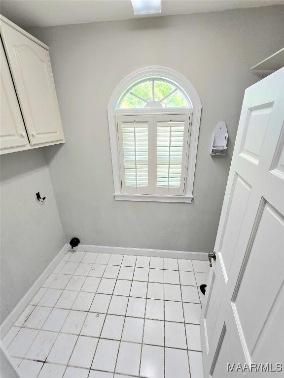 49 Berkeley Rd, Selma, AL 36701 - laundry room featuring baseboards and cabinet space