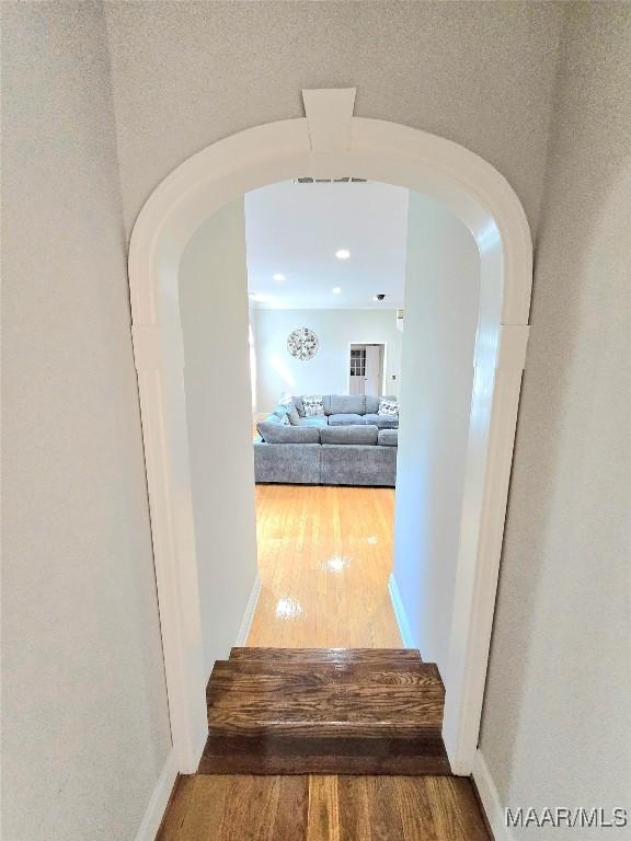 49 Berkeley Rd, Selma, AL 36701 - hall featuring arched walkways and wood finished floors