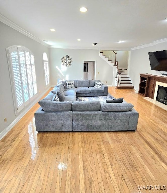 49 Berkeley Rd, Selma, AL 36701 - living area featuring stairs, crown molding, wood finished floors, baseboards, and recessed lighting