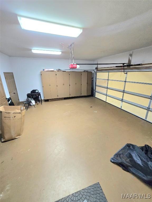 49 Berkeley Rd, Selma, AL 36701 - garage featuring a garage door opener