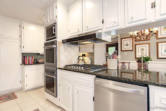 kitchen featuring stainless steel appliances, under cabinet range hood, white cabinetry, and light tile patterned flooring