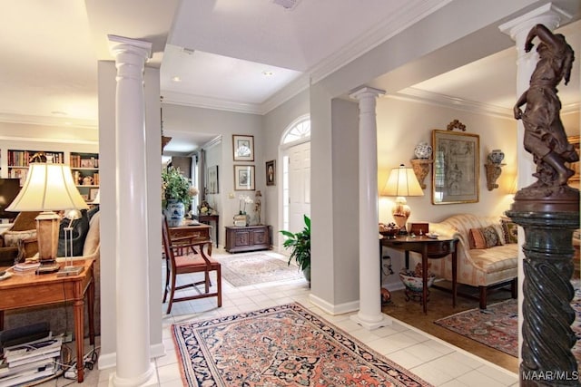 entrance foyer featuring decorative columns, light tile patterned flooring, and ornamental molding
