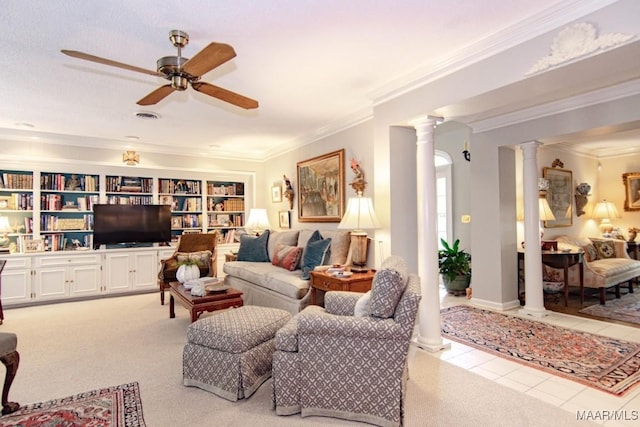 living room featuring decorative columns, ornamental molding, and a ceiling fan