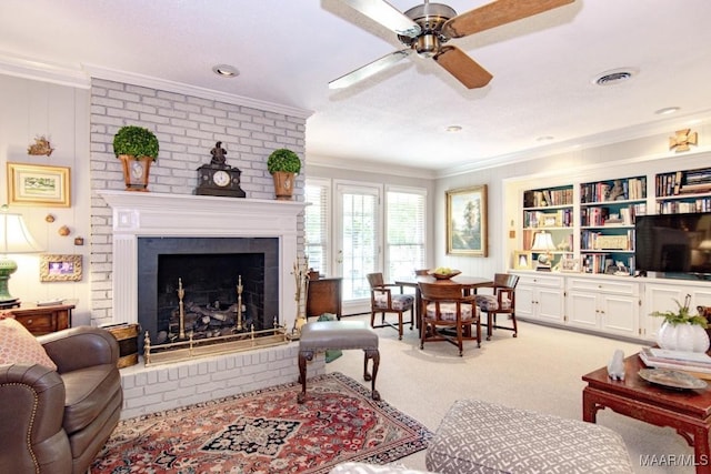 living area with crown molding, light carpet, a ceiling fan, and a brick fireplace