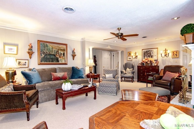 living room with carpet, ceiling fan, and crown molding