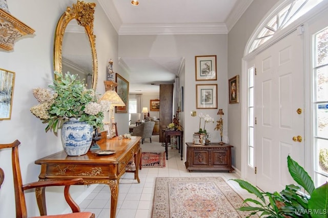 foyer with plenty of natural light, light tile patterned flooring, crown molding, and baseboards
