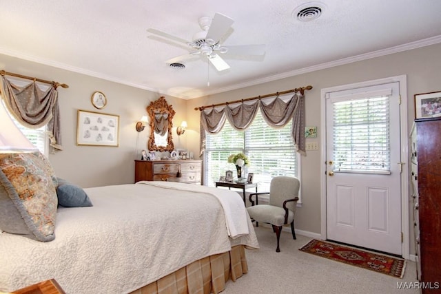 carpeted bedroom featuring crown molding and a ceiling fan