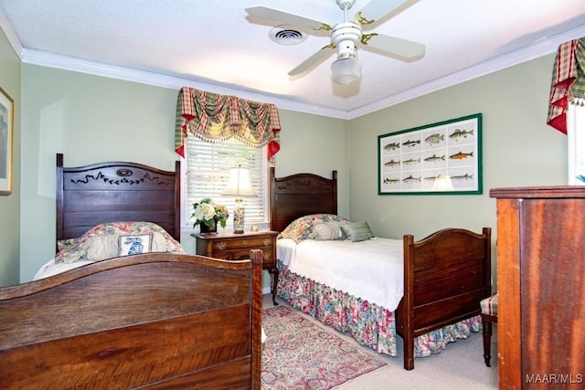 carpeted bedroom featuring crown molding and ceiling fan