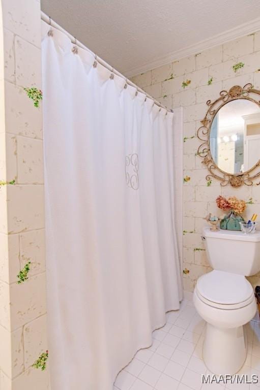 full bathroom with tile patterned floors, toilet, and crown molding