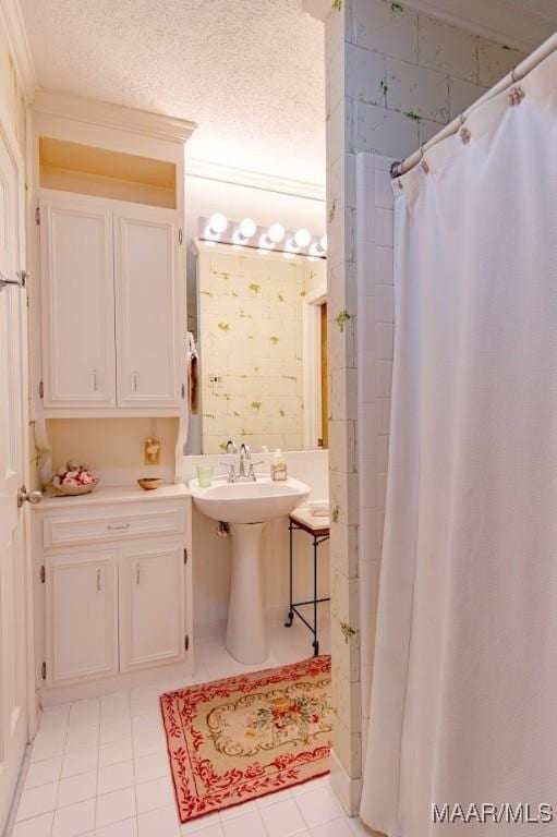 full bathroom with tile patterned flooring, a sink, and a shower with curtain