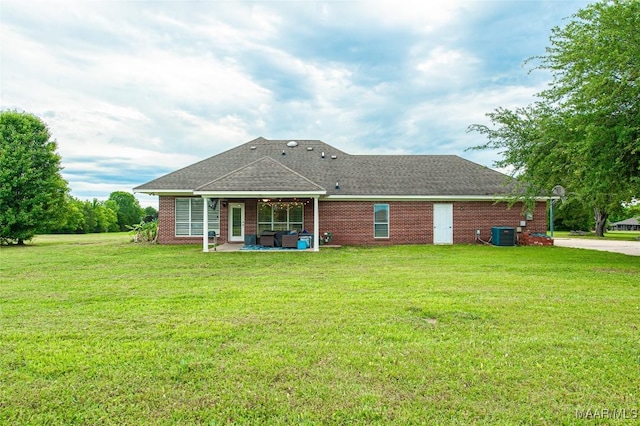 331 Bush Dr, Hope Hull, AL 36043 - back of house featuring a lawn, a patio area, brick siding, and central air condition unit