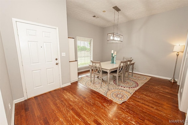 331 Bush Dr, Hope Hull, AL 36043 - dining room featuring wood finished floors, baseboards, a textured ceiling, and a chandelier