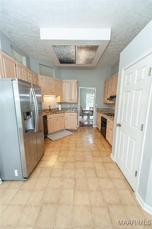 331 Bush Dr, Hope Hull, AL 36043 - kitchen featuring stainless steel fridge with ice dispenser, light brown cabinets, a textured ceiling, black dishwasher, and light countertops