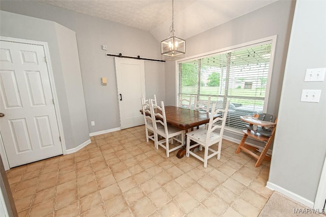 331 Bush Dr, Hope Hull, AL 36043 - dining area featuring a barn door, a chandelier, and baseboards