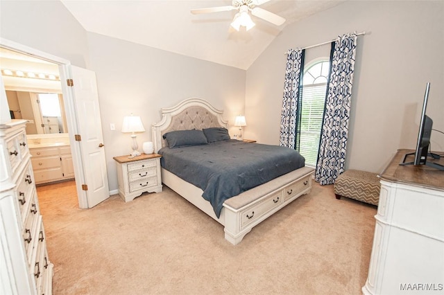 331 Bush Dr, Hope Hull, AL 36043 - bedroom with vaulted ceiling, light carpet, ensuite bathroom, and a ceiling fan