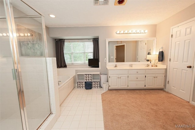 331 Bush Dr, Hope Hull, AL 36043 - bathroom with a garden tub, tile patterned floors, a stall shower, double vanity, and recessed lighting