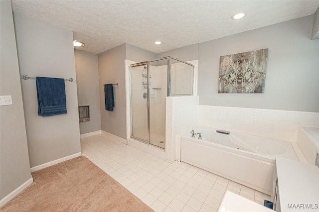 331 Bush Dr, Hope Hull, AL 36043 - full bath featuring a garden tub, a stall shower, tile patterned flooring, recessed lighting, and a textured ceiling