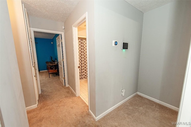 331 Bush Dr, Hope Hull, AL 36043 - hall with a textured ceiling, light colored carpet, and baseboards