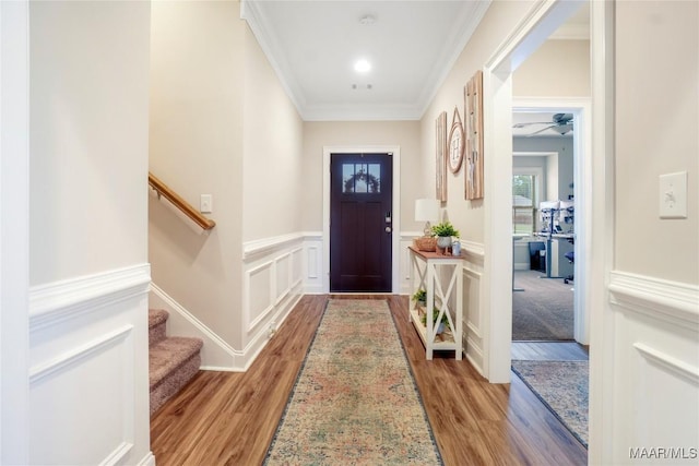 1412 Wildlife Way, Prattville, AL 36066 - doorway featuring light wood-style flooring, wainscoting, ornamental molding, ceiling fan, and stairway