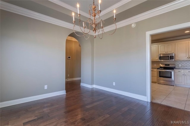 5906 Amberwood Ln, Montgomery, AL 36116 - empty room with arched walkways, crown molding, a chandelier, and light wood-style flooring